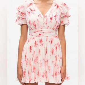 Self-Portrait minidress features an A line silhouette crafted of pleated chiffon